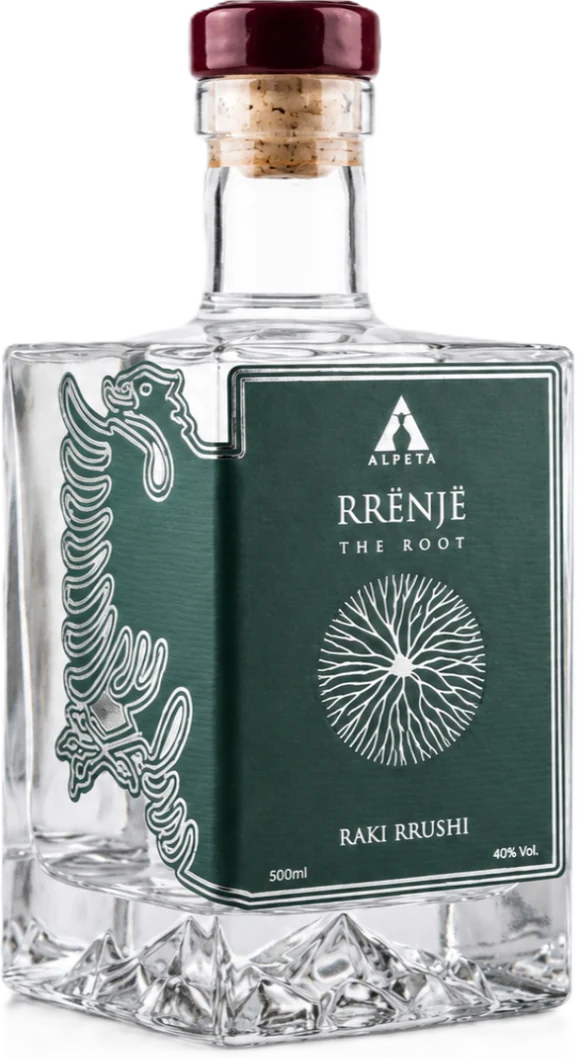 Bottle of Rrënjë grape raki: clear spirit in a square decanter with a deep green label and a root sketch